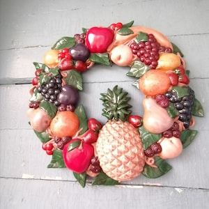 Wall-mounted ceramic fruit wreath