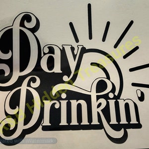 May include: Black and white vinyl decal with the text "Day Drinkin'" in a stylized font. The text is surrounded by a sunburst design.