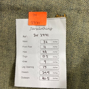 May include: A white tag with black text listing measurements in inches for a pair of jeans. The tag includes the following measurements: Waist: 32 inches, Front Rise: 11 inches, Hips: 44 inches, Thigh: 12.5 inches, Knee: 9 inches, Leg Opening: 15 inches, Inseam: 29.5 inches, Outseam: 40.5 inches.