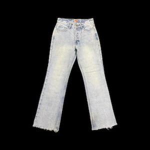 May include: Light wash denim jeans with a high waist and a slight flare at the hem. The jeans have a classic five-pocket design, a button and zipper closure, and a frayed hemline. The jeans are a light blue color.