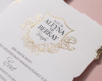 Delicate Gold Monogram, Soft Floral Details, Classic White Palette, Timeless Elegance, Wedding Invitation