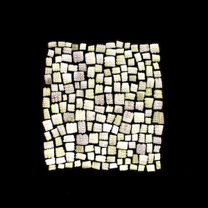 May include: A collection of small, square, off-white objects with a textured surface, arranged in a rectangular pattern against a black backdrop. The objects, of varying sizes, are closely packed, creating a dense, textured visual effect.