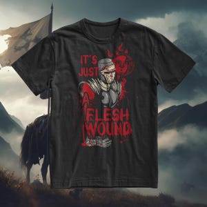 Puede incluir: Camiseta negra con un gráfico de un caballero con armadura con una espada ensangrentada y el texto "Es solo una herida de carne".