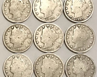 May include: Nine silver Liberty Head five-cent coins, also known as nickels, from the early 1900s. The coins are arranged in three rows of three. The dates on the coins are 1900, 1904, 1906, 1907, 1911, and 1912.