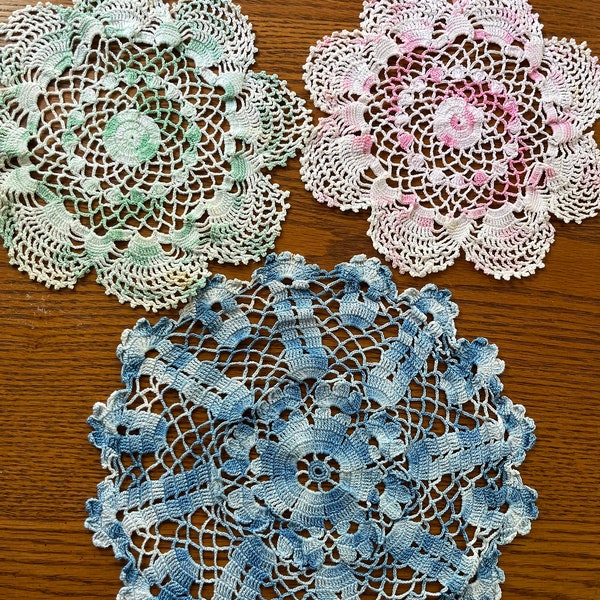 Three hand crocheted delicate doilies