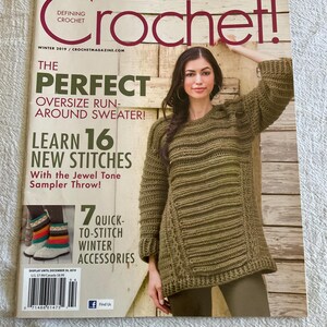 May include: A magazine cover with the title "Crochet!" features a woman wearing a green crochet sweater. The cover includes text about winter designs, an oversized sweater, new stitches, and winter accessories.