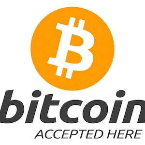 May include: The Bitcoin logo features a white 'B' symbol within an orange circle. Below, the word 'bitcoin' is in dark grey, with 'ACCEPTED HERE' underneath, all on a white background.