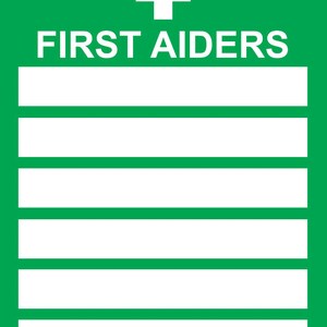 May include: A green sign with a white cross and the text "FIRST AIDERS" with six blank lines below.