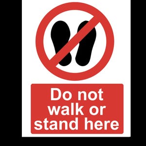 May include: A red and white sign with a red circle and a diagonal line through it. Inside the circle are two black footprints. The sign says "Do not walk or stand here".