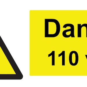 May include: A yellow warning sign with a black triangle and lightning bolt symbol. The text "Danger 110 volts" is on a yellow rectangular sign.