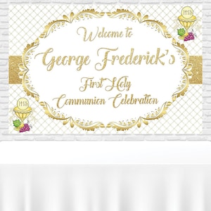 May include: Gold and white first communion banner with the text "Welcome to George Frederick's First Holy Communion Celebration". The banner is decorated with gold glitter and floral designs. There are gold balloons in the background.