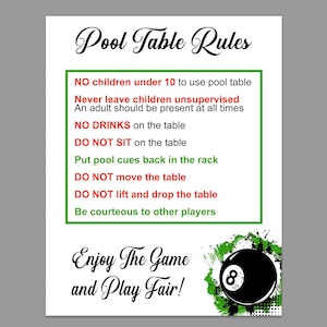 May include: A white poster with black text that reads "Pool Table Rules." The poster includes rules for pool table etiquette, such as "No drinks on the table" and "Enjoy the game and play fair!" A black 8-ball is in the lower right corner.