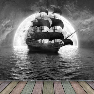 May include: A black sailing ship with billowing sails is silhouetted against a large, bright moon in a starry night sky. The ship is sailing on a dark, choppy sea. A wooden floor is in the foreground.