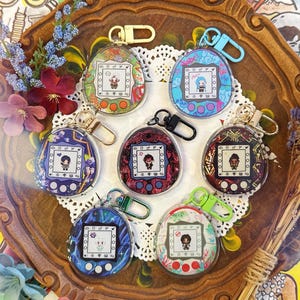 R Cane (League of L) Tamagotchi-sleutelhangers