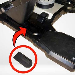 May include: A black plastic base with a small black rubber foot. The foot is shown separately in a red circle.