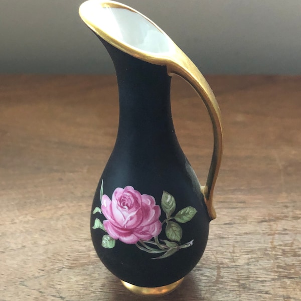 Vintage black west German vase with flowers and gold trim