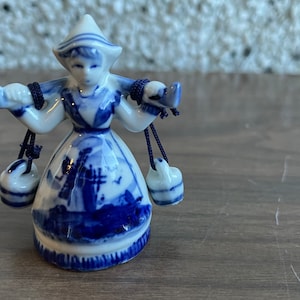 Vintage Dutch girl with buckets bell