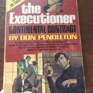 May include: A paperback book cover with a red background and the title "The Executioner: Continental Contract" by Don Pendleton. The cover features a man in a black turtleneck holding a gun, with a scene of a man being shot in the background.
