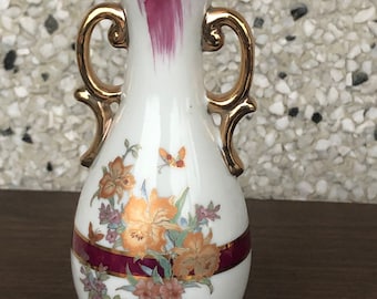 white floral and maroon vintage vase with gold trim