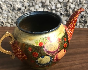 small tin teapot