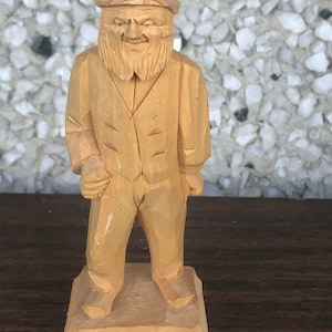Hand carved pine fisherman by Atelier Noel Guay