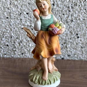 vintage porcelain girl fruit basket figurine