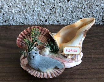 Florida-Souvenir-Muscheln und Fuzzy-Siegel