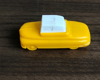 Vintage yellow plastic car pencil sharpener