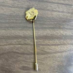 Vintage gold colored flower lapel pin