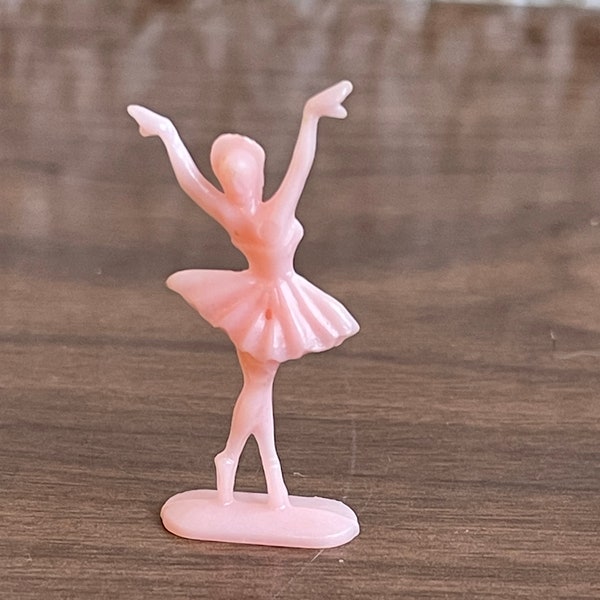 Vintage pink plastic dancer