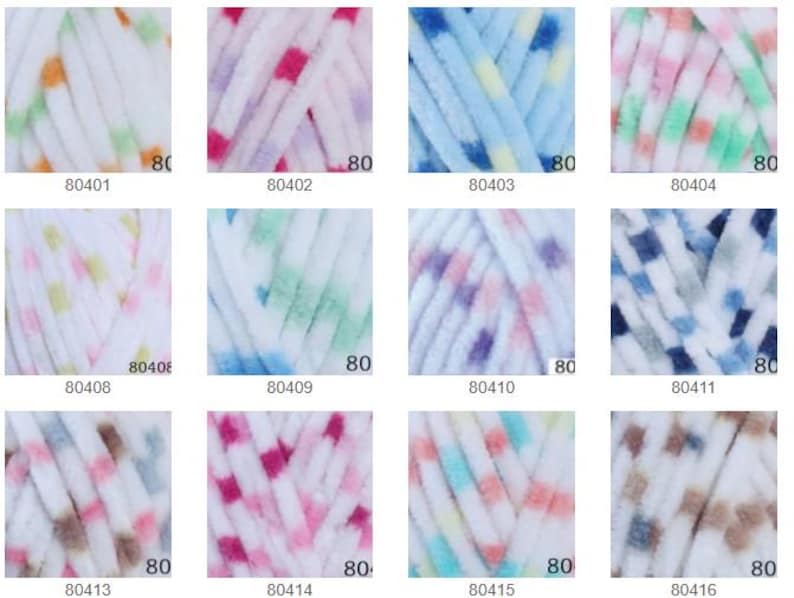 May include: A selection of yarn skeins in various colours. Each skein is white with a pattern of coloured dots. The colours include green, orange, pink, blue, and brown. The number "80" is printed on each skein, along with a product code.