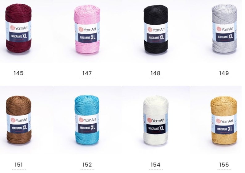 May include: Assortment of ten spools of macrame cord in various colors, including burgundy, pink, black, gray, brown, teal, white, and gold. Each spool is labeled "YarnArt Macrame XL".