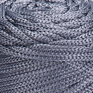 May include: Close-up of a coiled gray rope with a braided texture.
