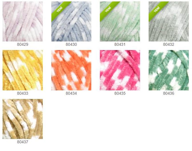May include: A selection of colourful yarn skeins, each with a soft, textured appearance. The colour palette includes shades of pink, blue, green, grey, yellow, orange, and beige. Each skein has a unique colour combination and a product code.