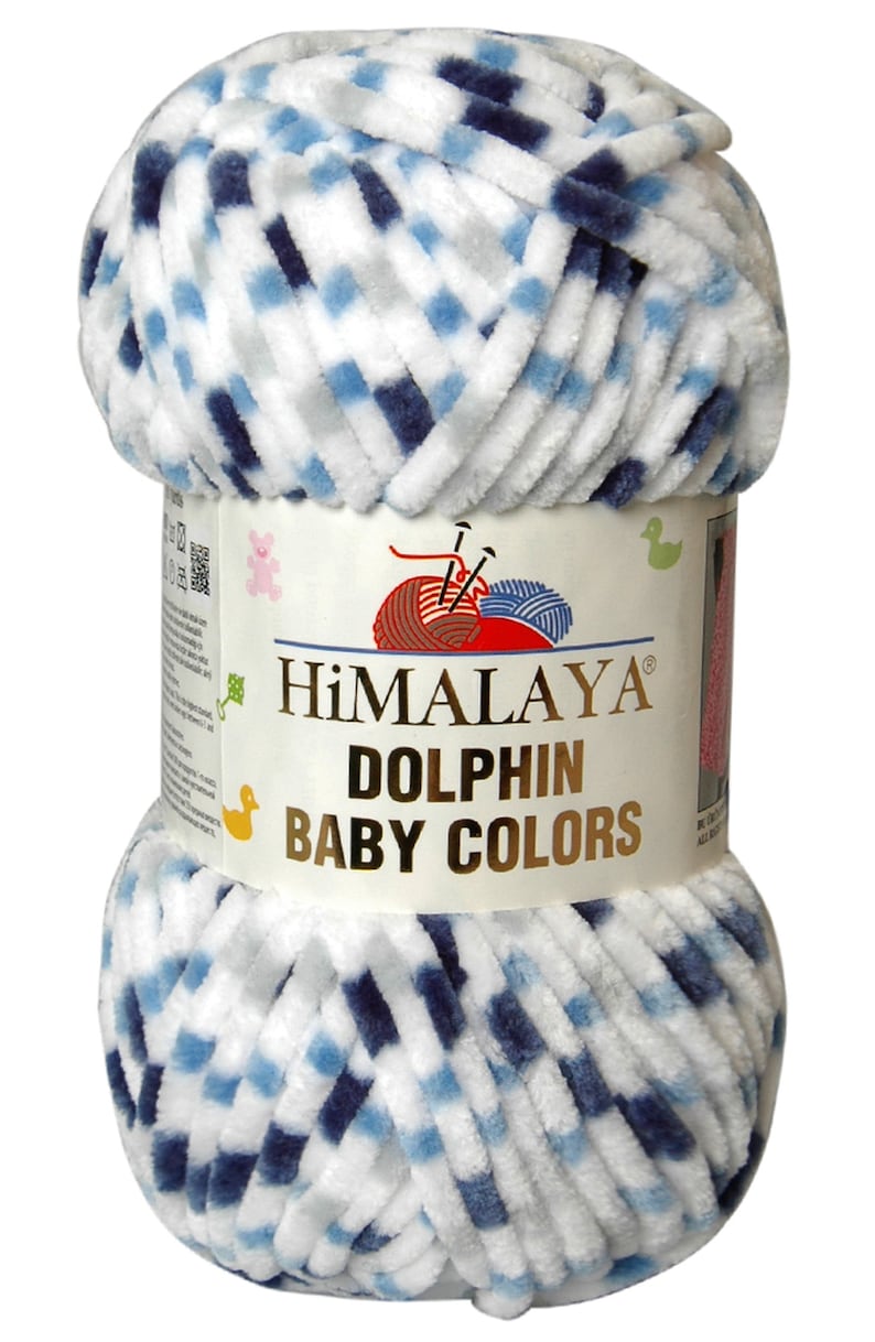 May include: A ball of Himalaya Dolphin Baby Colors yarn. The yarn is a soft, plush material in white with a pattern of blue and grey squares. The label reads "Himalaya Dolphin Baby Colors".
