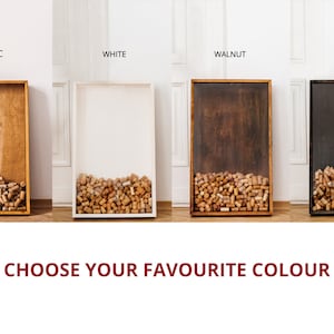 May include: Four different colored wooden frames with glass fronts filled with cork stoppers. The frames are labeled "Rustic", "White", "Walnut", and "Black". The text "CHOOSE YOUR FAVORITE COLOR" is below the frames.