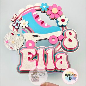 May include: A layered cake topper featuring a pink and blue roller skate, flowers, a disco ball, and the name "Ella" in a retro font. The number "8" is also included. The design is accented with glitter and rainbow details.