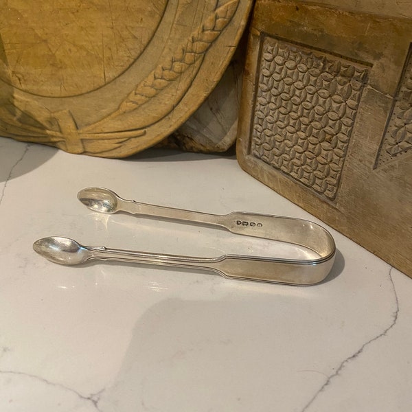 Stylish Sterling Silver sugar tongs, possibly Georgian. Hallmarked with makers mark.