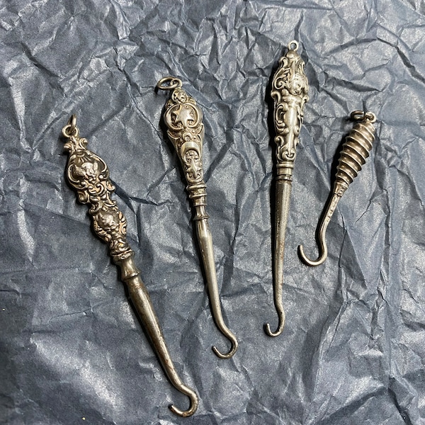 Beautiful small chatelaine button hook. Priced individually. Four available. Smallest one is all silver.