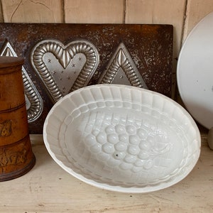 Ironstone grape jelly mould.