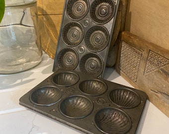 Vintage baking tins. One by ACME, the other is possibly french.