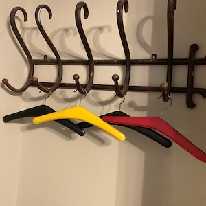 Mid century vinyl padded coat hanger. Four available, priced individually.