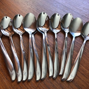 Vintage MCM atomic starburst pattern forks, spoons, knives by MARCREST & ONEIDA, stainless steel