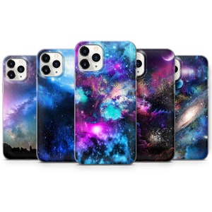 May include: Five different phone cases with a galaxy space theme. The cases feature a dark blue background with swirling nebulae in shades of pink, purple, and blue. Some cases have a planet or star in the background.