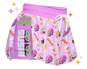May include: Pink athletic shorts with a sushi print and a phone pocket. The shorts have a white drawstring and a white "SUSHI" logo on the pocket.