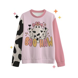 May include: A pink and black cow print sweatshirt with a pink ghost wearing a cowboy hat and the text "BOO HAW" in orange and yellow.