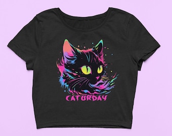 May include: Black cropped t-shirt with a rainbow-colored cat illustration and the text "CATURDAY" in pink.