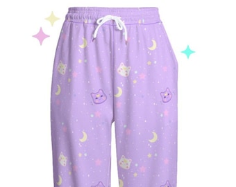 May include: Purple sweatpants with a repeating pattern of white stars, yellow moons, and purple cat faces.