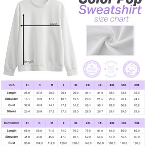 May include: Size chart for a white sweatshirt with a crew neck. The chart shows measurements in inches and centimeters for sizes XS to 6XL. The chart includes measurements for length, shoulder, bust, and sleeve.