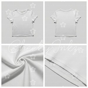 May include: A plain white short-sleeve t-shirt shown from the front and back, featuring a crew neckline and a smooth fabric texture. The image includes detailed close-up views of the soft material folds and the stitched hemline of the garment.